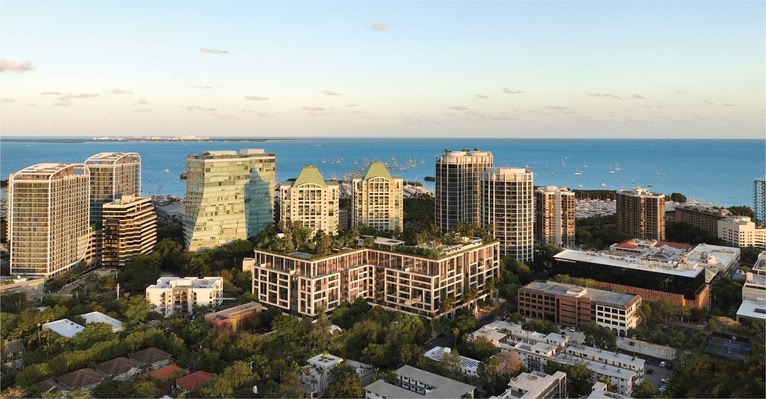 THE WELL Coconut Grove — eight-story wellness residence at 2835 Tigertail Avenue, with coral-stone façade, lush landscaping, and 40,000 sf rooftop wellness oasis.